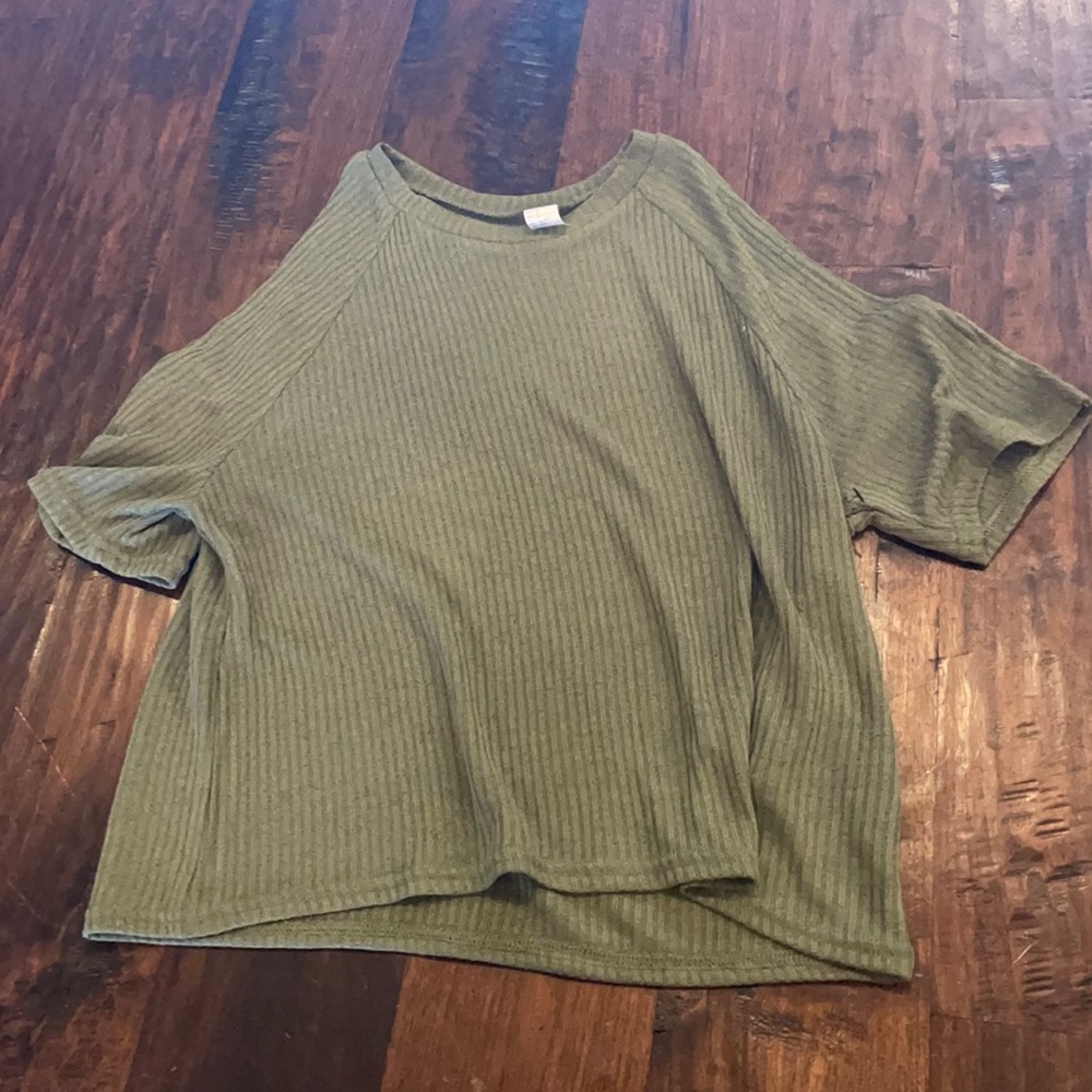 Women’s green top with shoulder cut outs